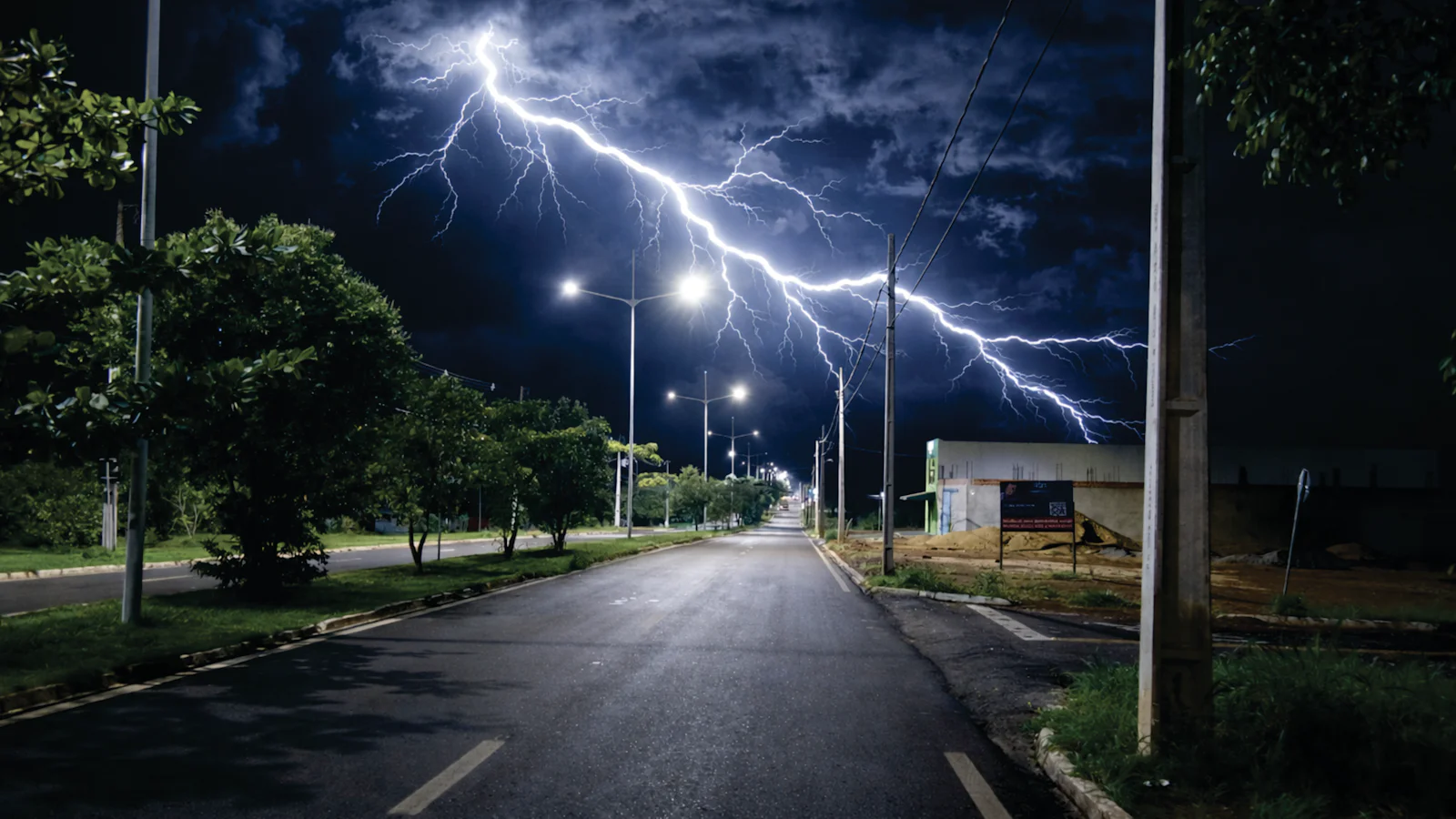 Lightning over a street at night