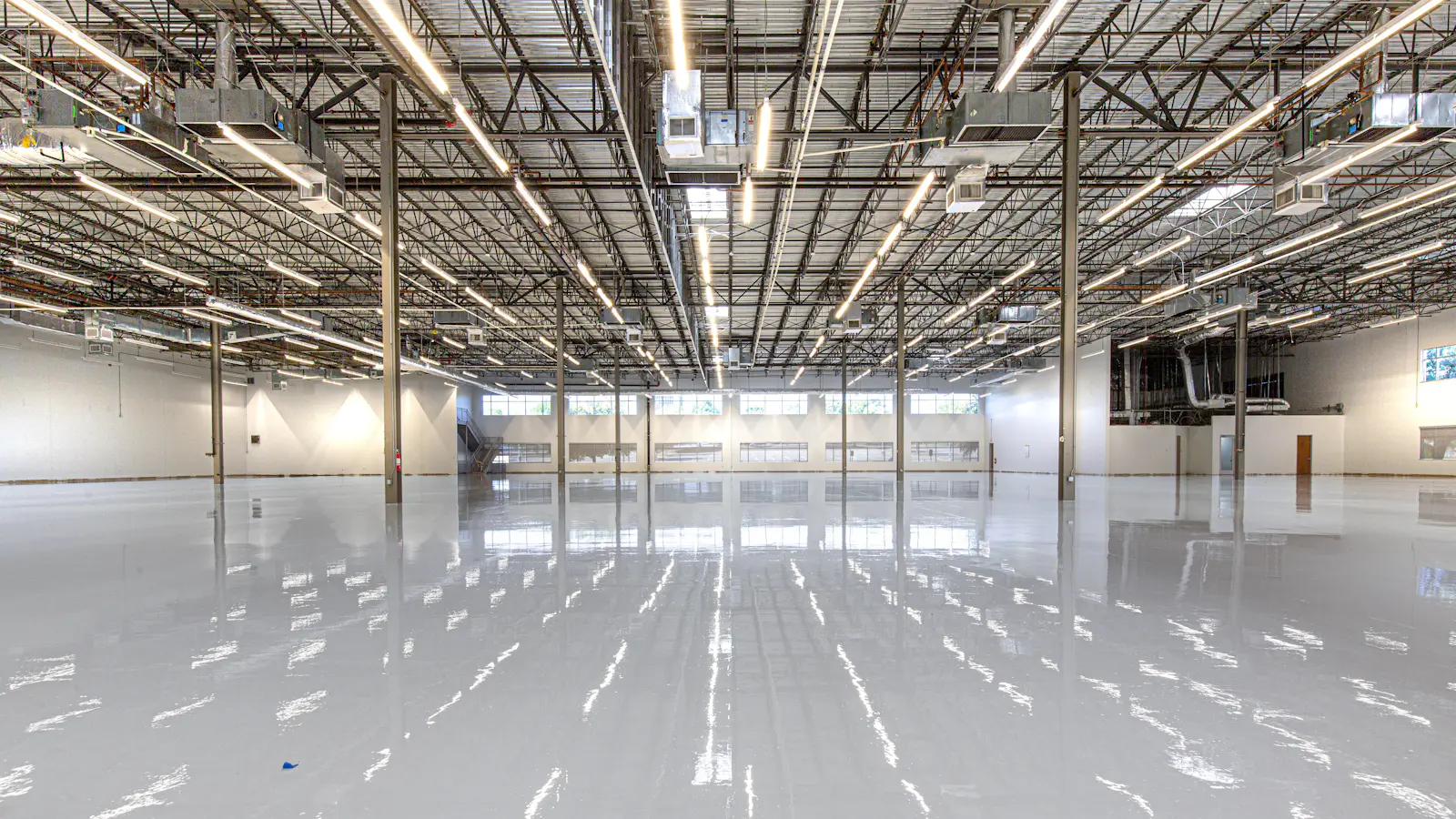 Bright overhead lighting in a large warehouse
